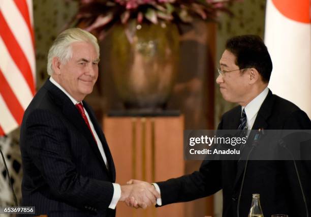 Secretary of State Rex Tillerson shakes hands with his Japanese counterpart Fumio Kishida at the end of their joint press conference at the Iikura...