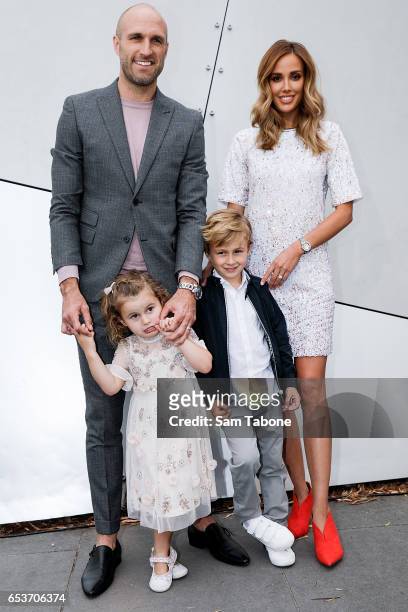 Chris Judd and his wife Rebecca Judd pose with their children Oscar and Billie during the VAMFF 2017 NEXT 'Under The Blade' runway show on March 16,...
