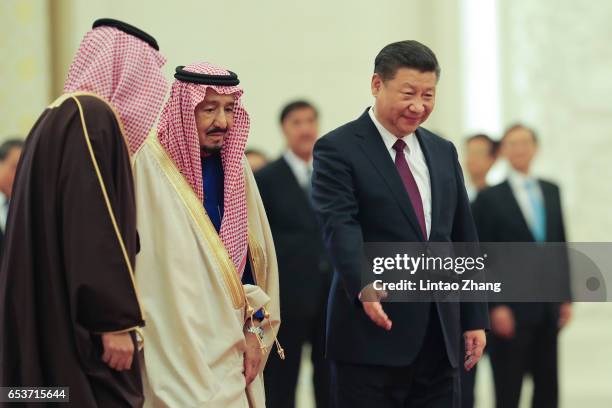 Chinese President Xi Jinping invites Saudi Arabia's King Salman bin Abdulaziz Al Saud to view an honour guard during a welcoming ceremony inside the...