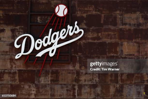 Los Angeles Dodgers logo is seen on the front office during a spring training game between the Los Angeles Dodgers and the San Francisco Giants at...