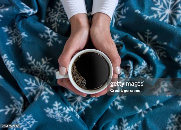 holding a cup of coffee - winter warm stock pictures, royalty-free photos & images