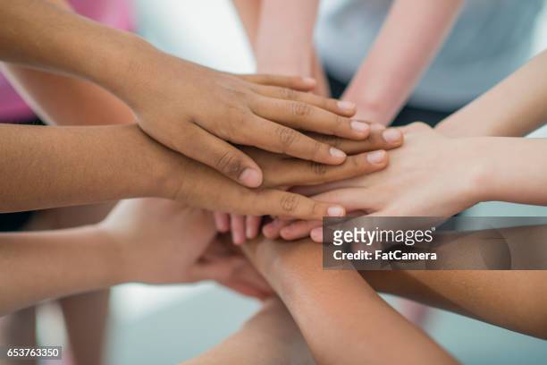 team huddle - hand stack stock pictures, royalty-free photos & images