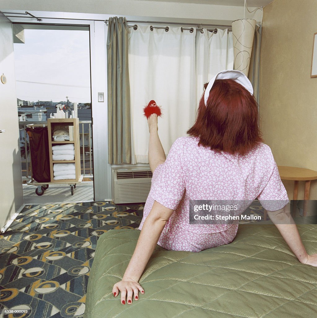 Cleaning Woman on Bed