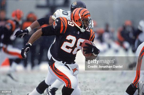 Corey Dillon of the Cincinnati Bengals moves with the ball during the game against the Jacksonville Jaguars at the Paul Brown Stadium in Cincinnati,...