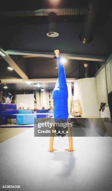 boy exercising gymnastic - boy handstand stock pictures, royalty-free photos & images