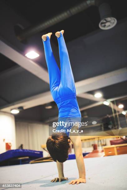 boy exercising gymnastic - gymnastics equipment stock pictures, royalty-free photos & images