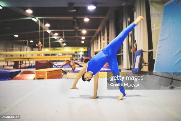 boy exercising gymnastic - gymnastics equipment stock pictures, royalty-free photos & images