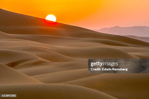 red sunset and sand dunes - arabian peninsula stock pictures, royalty-free photos & images