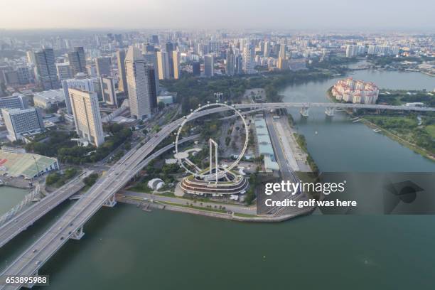 aerial view over singapore skyline - merlion statue stock pictures, royalty-free photos & images