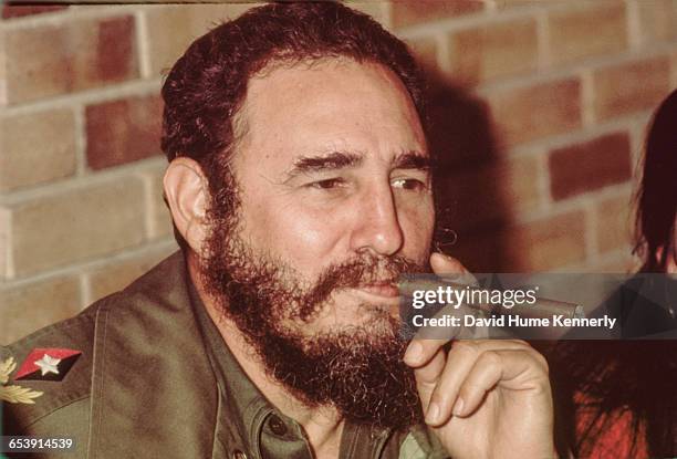 Fidel Castro smokes a cigar in his office in Havana, Cuba, circa 1977.