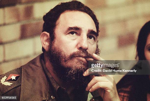 Fidel Castro smokes a cigar in his office in Havana, Cuba, circa 1977.