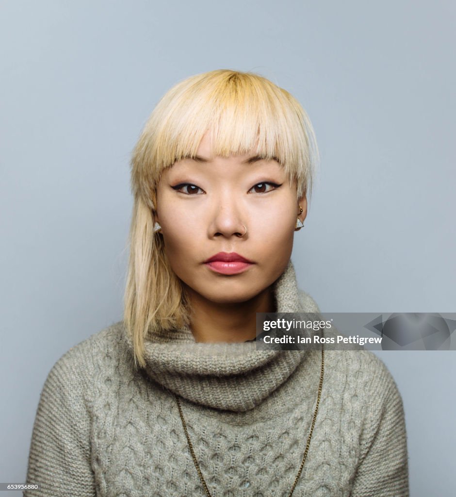 Portrait of Asian woman with blonde hair