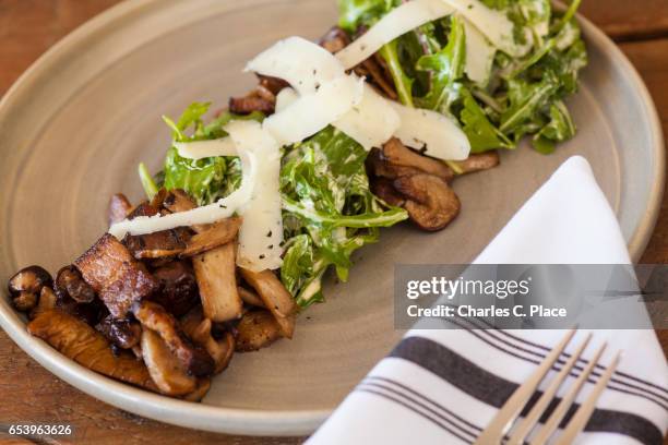 mushroom salad with bacon and arugula - charles rocket stock pictures, royalty-free photos & images