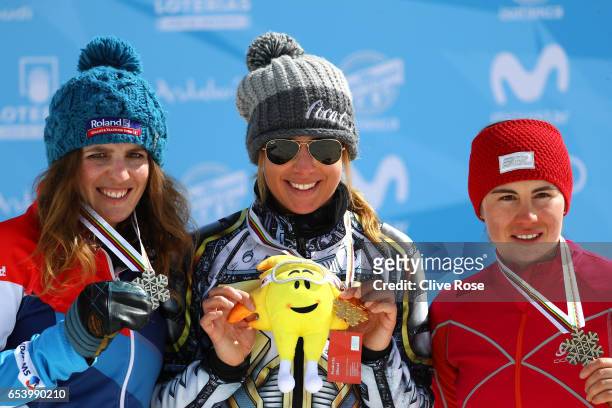 Silver medalist Patrizia Kummer of Switzerland, gold medalist Ester Ledecka of the Czech Republic and bronze medalist Ekaterina Tudegesheva of Russia...