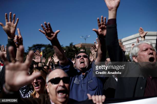 Hundred of taxi drivers who are on strike to protest take part in a protest against app-based car transport company Uber in Madrid, Spain on March...