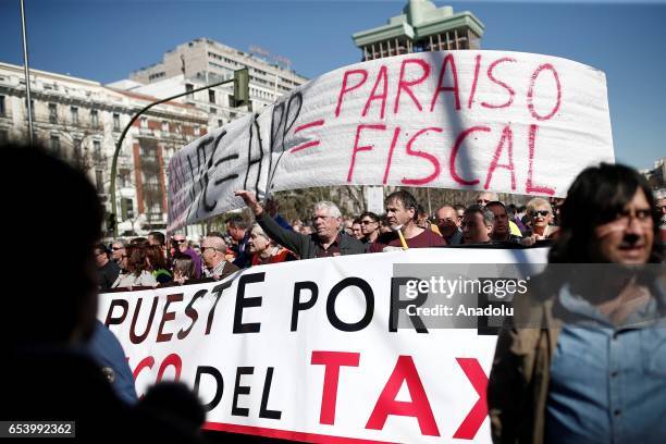 Hundred of taxi drivers who are on strike to protest take part in a protest against app-based car transport company Uber in Madrid, Spain on March...