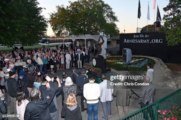 Curtis Strange speaks to a large gathering during the Arnold Palmer statue lighting ceremony at the Arnold Palmer Invitational presented by...