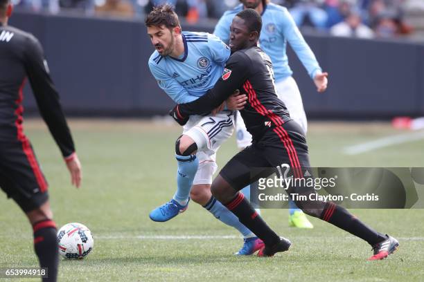 March 12: David Villa of New York City FC is challenged by Patrick Nyarko of D.C. United during the NYCFC Vs D.C. United regular season MLS game at...