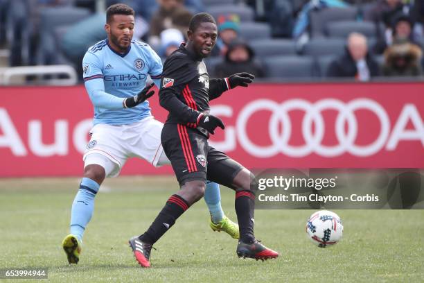 March 12: Patrick Nyarko of D.C. United is challenged by Ethan White of New York City FC during the NYCFC Vs D.C. United regular season MLS game at...