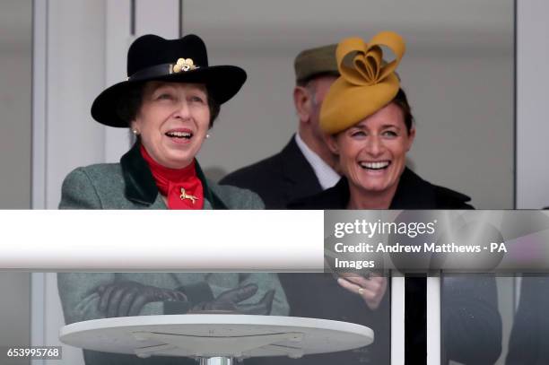 The Princess Royal and Dolly Maude watch the action from the JLT Novices Chase during St Patrick's Thursday of the 2017 Cheltenham Festival at...