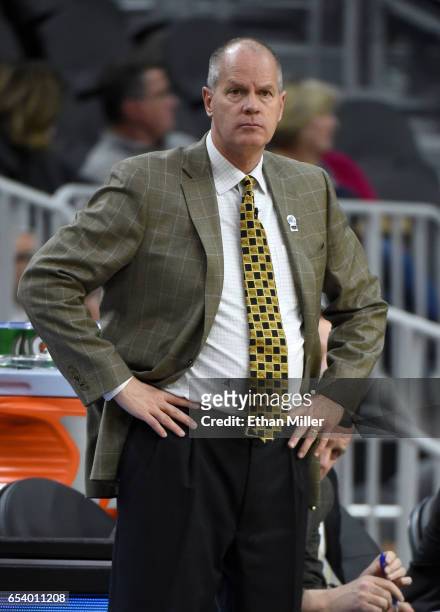 Head coach Tad Boyle of the Colorado Buffaloes looks on during a first-round game of the Pac-12 Basketball Tournament against the Washington State...