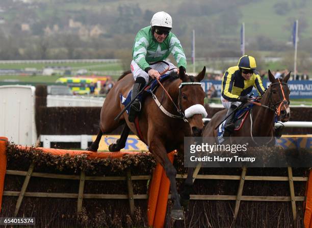 Presenting Percy ridden by Davy Russell jump the last to win the Pertemps Network Final Handicap Hurdle during St Patrick's Thursday of the...