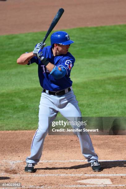 Doug Bernier of the Texas Rangers stands at bat against the Milwaukee Brewers in the spring training game at Maryvale Baseball Park on March 4, 2017...