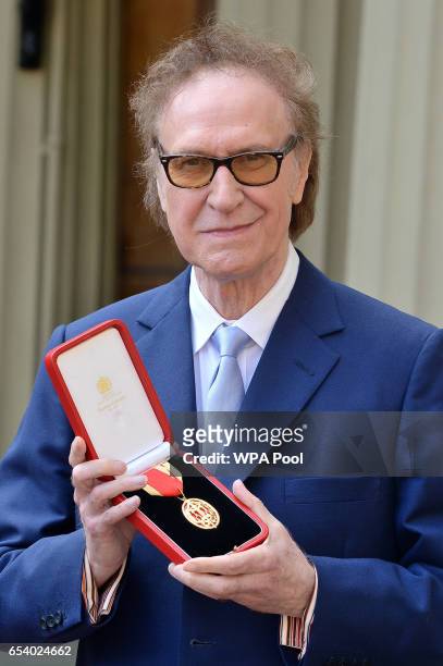 Kinks frontman Sir Ray Davies after he knighted by the Prince of Wales in recognition for his service to the arts during an investiture ceremony at...