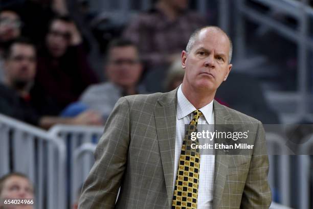 Head coach Tad Boyle of the Colorado Buffaloes looks on during a first-round game of the Pac-12 Basketball Tournament against the Washington State...
