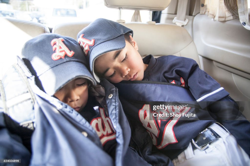 Youth Baseball Players, taking a break in the car