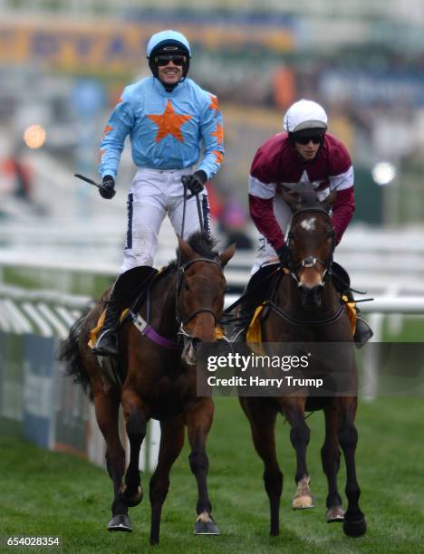 Ruby Walsh on board Un De Sceaux celebrates after victory in the Ryanair Steeple Chase during St Patrick's Thursday of the Cheltenham Festival at...