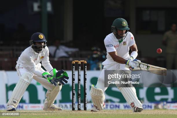 Bangladeshi batsman Sabbir Rahman, right, plays a shot as Sri Lanka's wicket keeper Niroshan Dickwella looks on against Sri Lanka during the second...