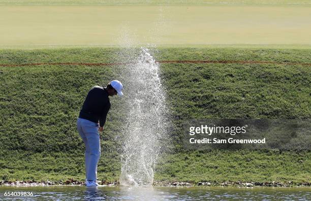 Harris English of the United States plays a shot from the water on the 11th hole during the first round of the Arnold Palmer Invitational Presented...