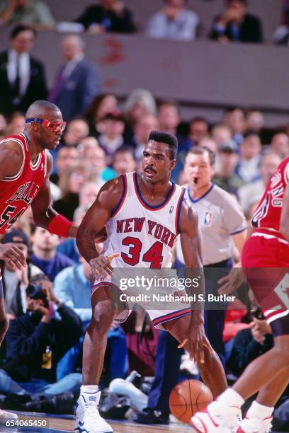 Charles Oakley of the New York Knicks posts up against the Chicago Bulls during a game played circa 1993 at the Madison Square Garden in New York...