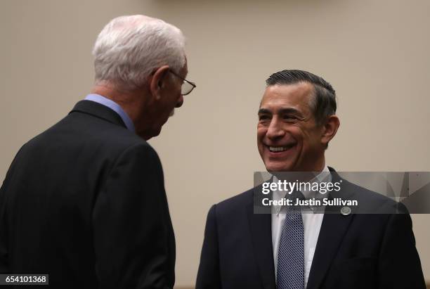 Ninth Circuit Appeals Court Judge Carlos Bea talks with U.S. Rep. Darrell Issa before the start of a House Judiciary Committee hearing on March 16,...