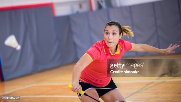woman playing badminton - women's badminton stock pictures, royalty-free photos & images