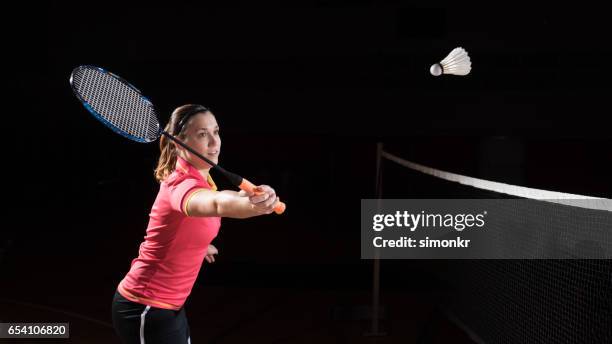 woman playing badminton - women's badminton stock pictures, royalty-free photos & images