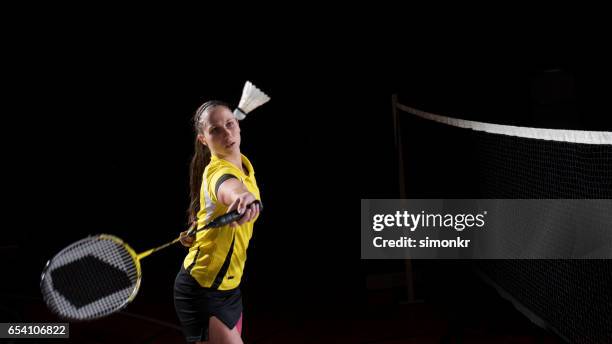 woman playing badminton - women's badminton stock pictures, royalty-free photos & images