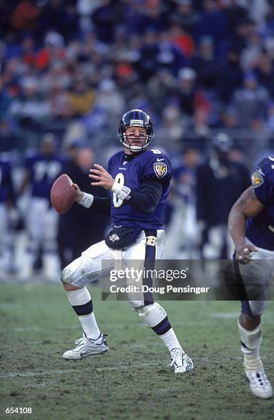 Trent Dilfer of the Baltimore Ravens drops back to pass the ball during the game against the New York Jets at the PSINet Stadium in Baltimore,...