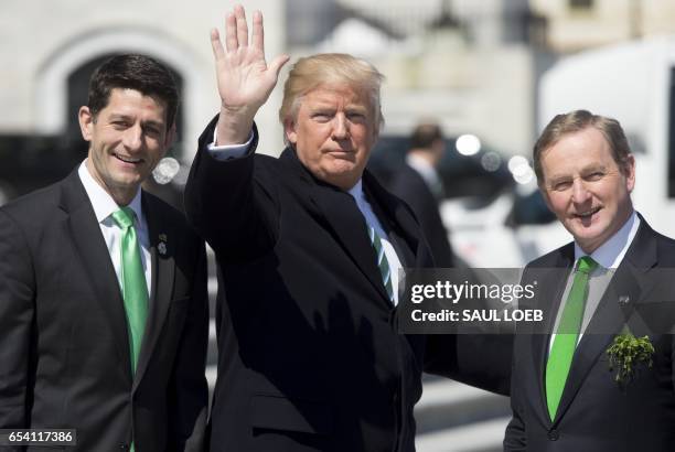 President Donald Trump waves alongside Speaker of the House Paul Ryan and Taoiseach of Ireland Enda Kenny as they leave the Friends of Ireland...