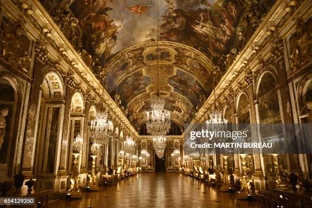 Picture taken on March 6, 2017 shows a view of the galerie des Glaces painted by French artist Charles Le Brun at the Versailles Castle, west of...