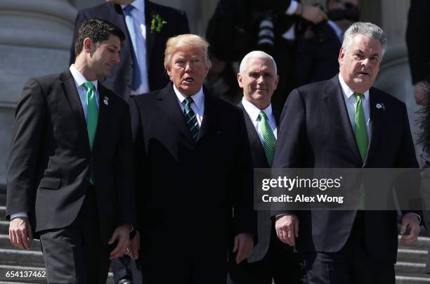 President Donald Trump , House Speaker Paul Ryan , Vice President Mike Pence and Rep. Peter King walk down the House east front steps after the...