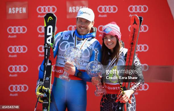 Kjetil Jansrud of Norway and Tina Weirather of Liechtenstein pose with their respective globes after winning the men's and ladies' Super-G season...