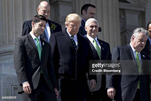 House Speaker Paul Ryan, a Republican from Wisconsin, from left, U.S. President Donald Trump, Vice President Mike Pence, and Representative Peter...