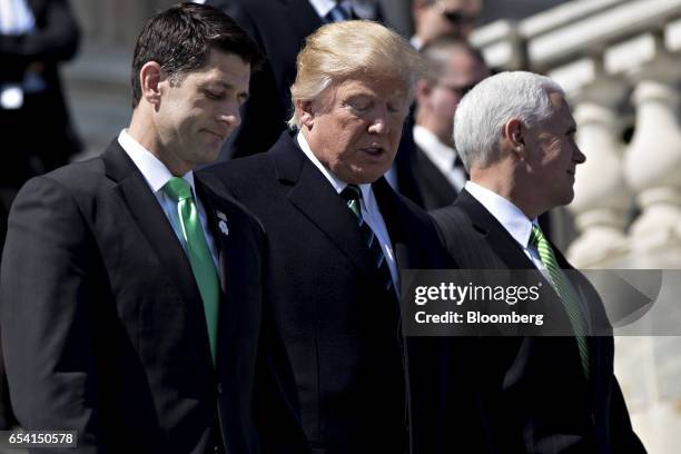 House Speaker Paul Ryan, a Republican from Wisconsin, from left, U.S. President Donald Trump, and Vice President Mike Pence walk down the steps of...