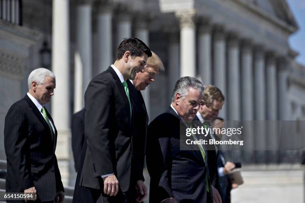 Vice President Mike Pence, from left, House Speaker Paul Ryan, a Republican from Wisconsin, U.S. President Donald Trump, Representative Peter King, a...