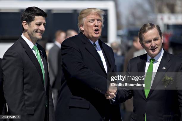 President Donald Trump, center, shakes hands with Enda Kenny, Ireland's prime minister, following a Friends of Ireland luncheon with U.S. House...