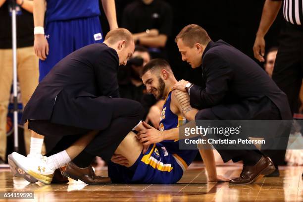 Michael Orris of the South Dakota State Jackrabbits receives treatment after an injury in the second half against the Gonzaga Bulldogs during the...