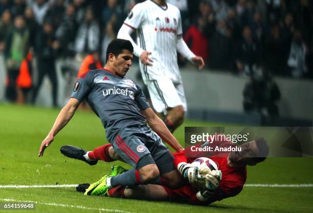 Fabricio Agosto Ramirez of Besiktas in action against Marko Marin of Olympiacos during the UEFA Europa League Round 16 second-leg match between...