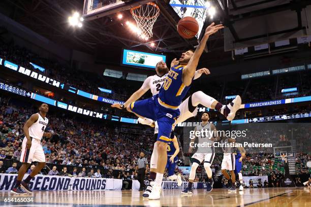 Michael Orris of the South Dakota State Jackrabbits drives to the basket against Przemek Karnowski of the Gonzaga Bulldogs in the second half during...